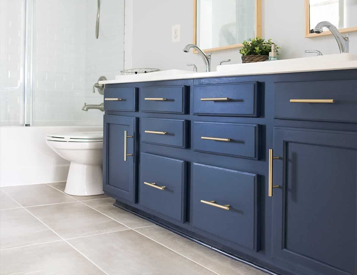 Navy dual Vanity from a builder grade one painted midnight blue