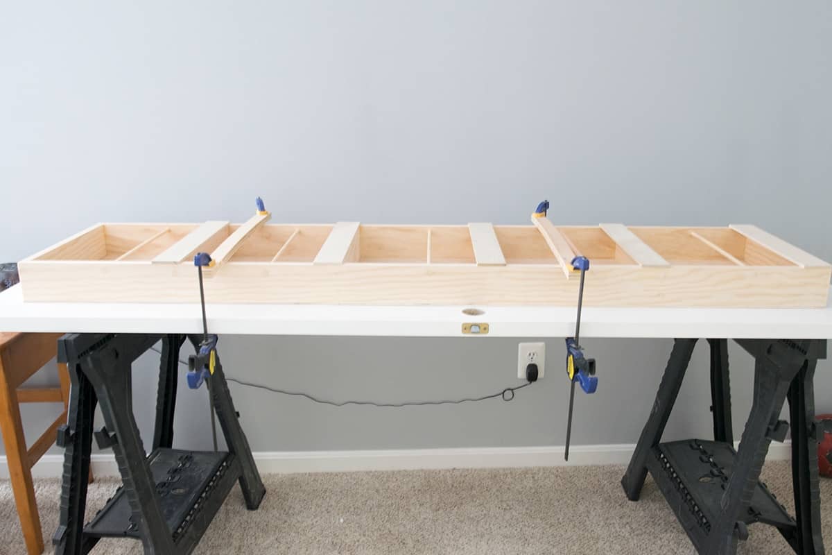 Closet door organizer on back of door mounted with construction adhesive..