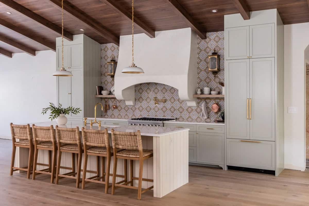 Benjamin Moore October Mist kitchen cabinetry with gold accents and large kitchen island.