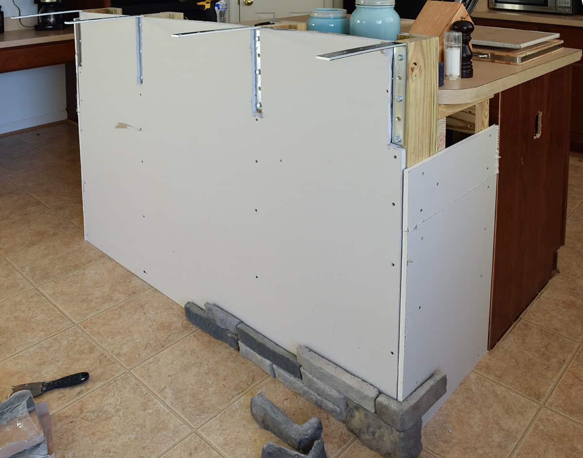 Breakfast bar added on kitchen island with drywall installed and airstone added to bottom corner.