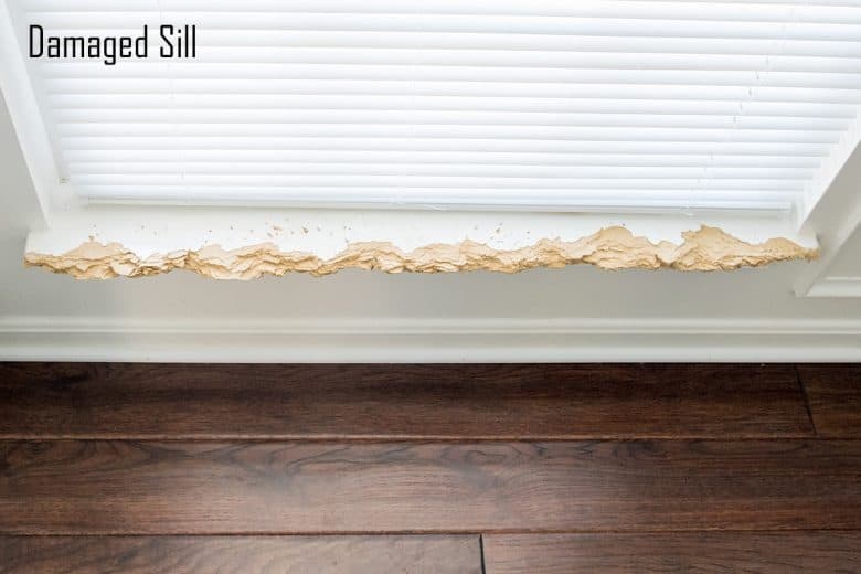 Damaged white window sill
