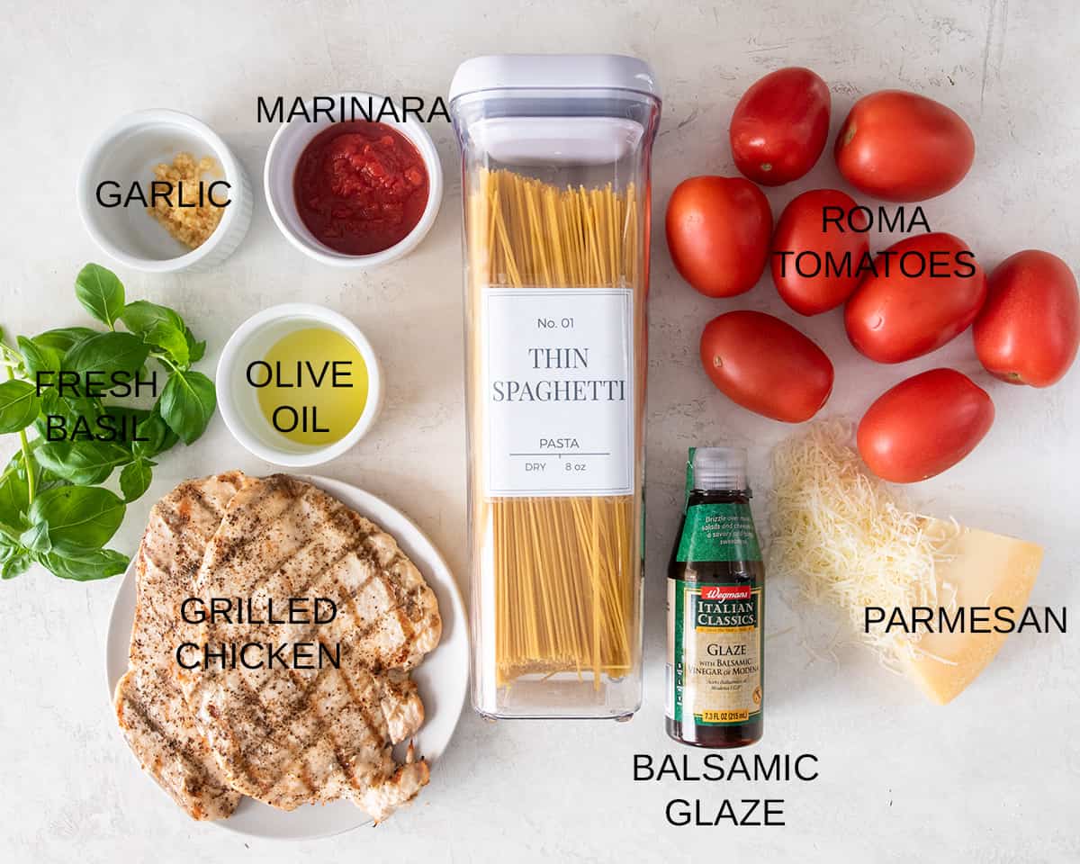 Bruschetta Chicken pasta ingredients on a table with text labels.