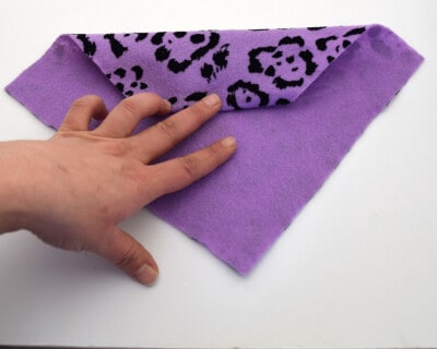 Closeup of rolling a napkin.