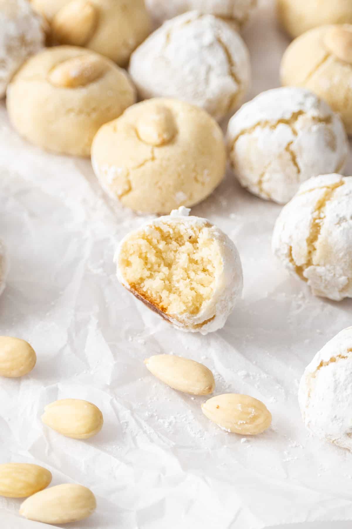 Chewy Italian amaretti cookies with a bite taken out.
