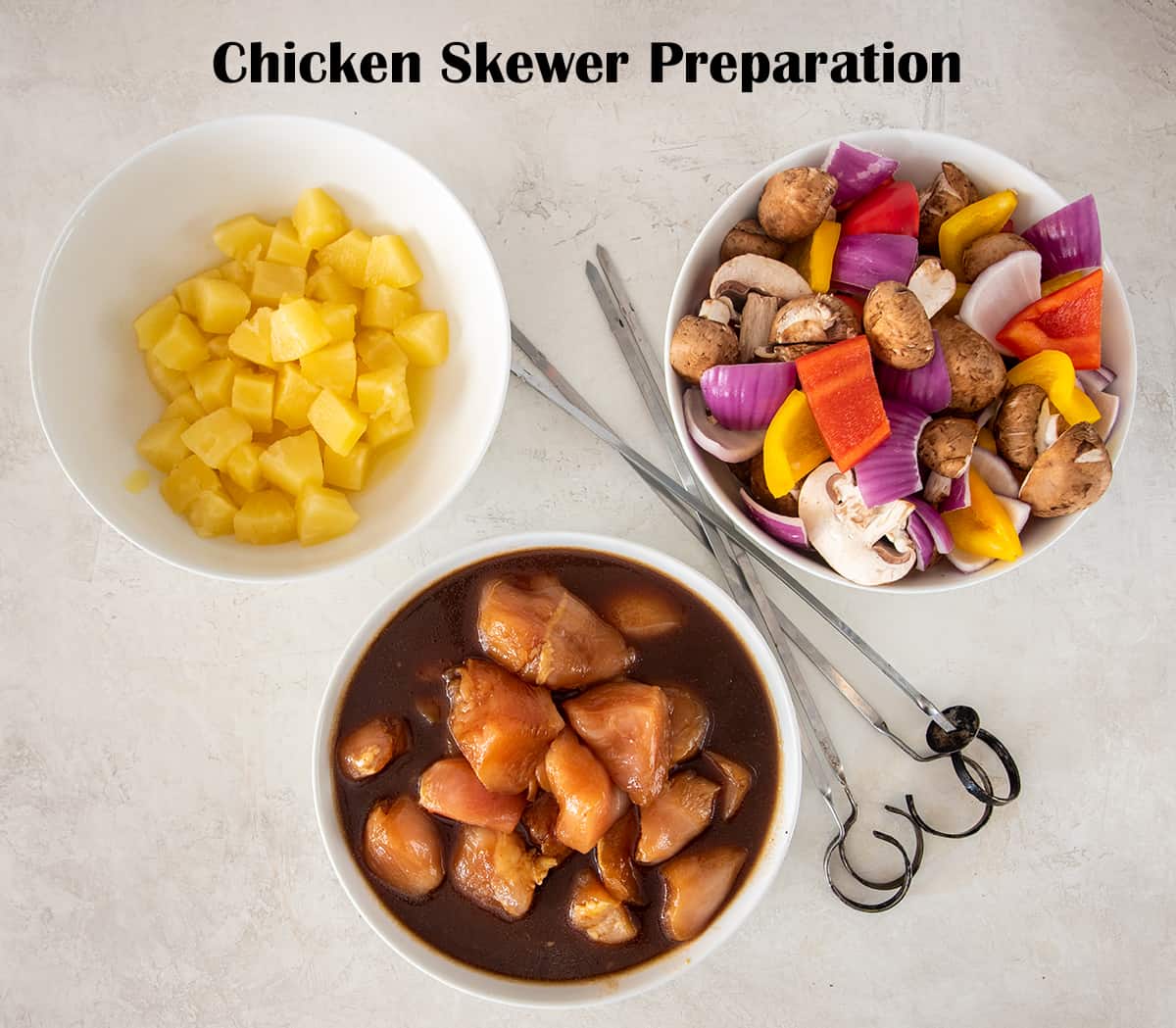 Ingredients for Chicken Skewer preparation with pineapple, vegetables, and marinated chicken.
