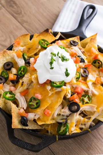 Shredded Chicken Nachos - Shredded Chicken and Cheese, Olives, Pickled Jalapenos and alll the trimmings for a supreme appetizer or game day treat.