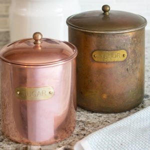 Before and after from removing tarnish from copper canisters.
