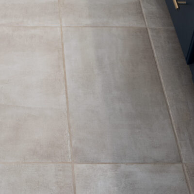 Dirty grout on a printed concrete floor.