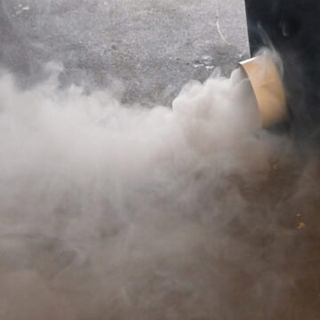Close up of a creating low lying fog with a fog chiller.