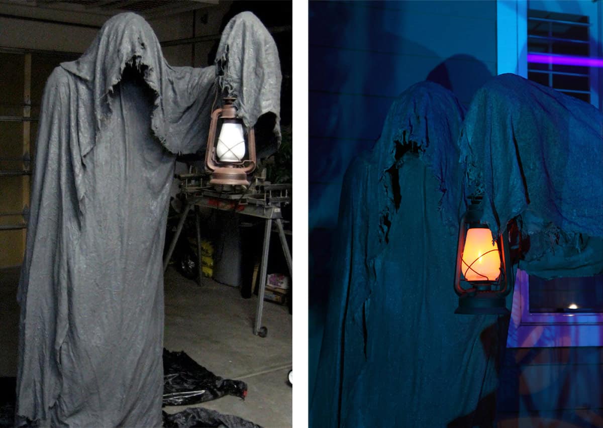A DIY grim reaper figure decoration for Halloween holding a lantern.