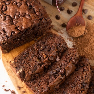 Double Chocolate Zucchini Bread sliced and laid out on a cutting board.