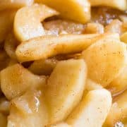 Closeup of fried apples with cinnamon in a bowl.