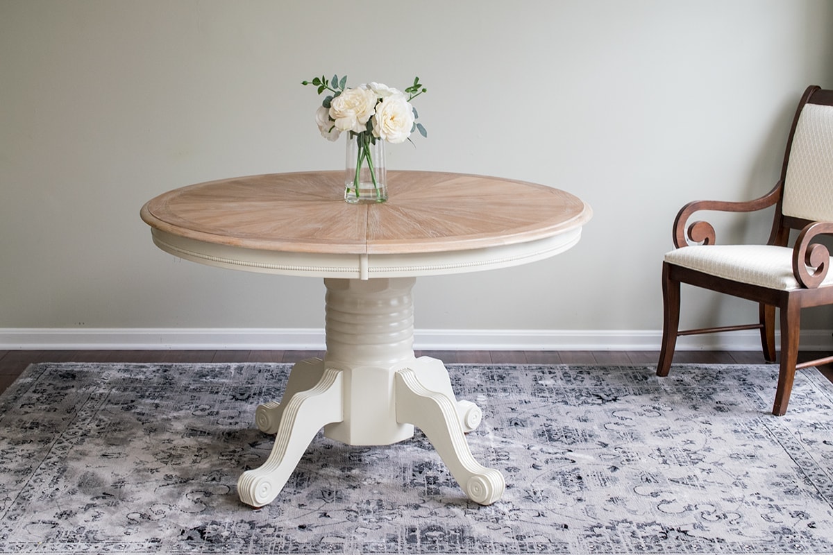 Finished cerused round dining room table without leaf insert.