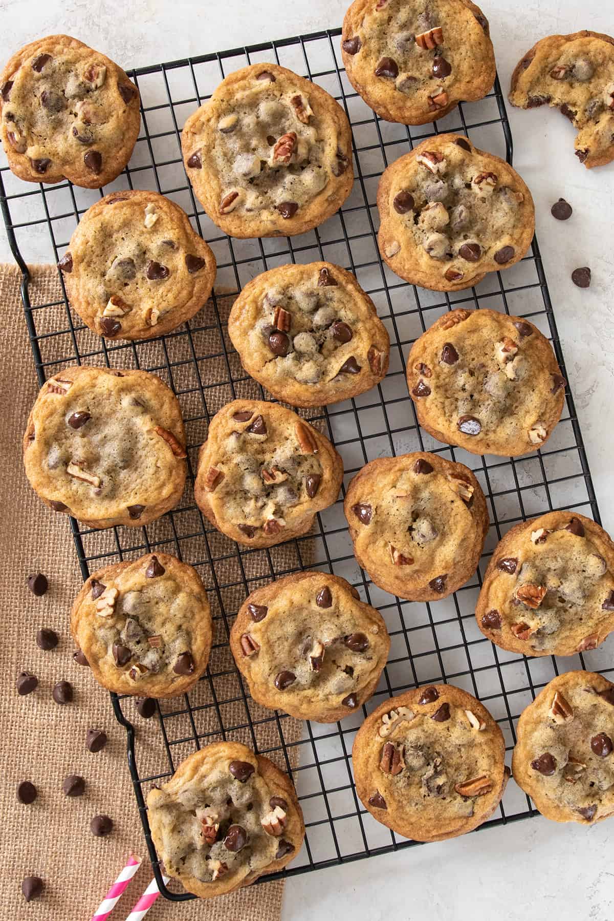 Top down view of the best crispy chocolate chip cookies with nuts.