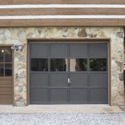 Gray garage door with windows.