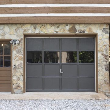 Gray garage door with windows.