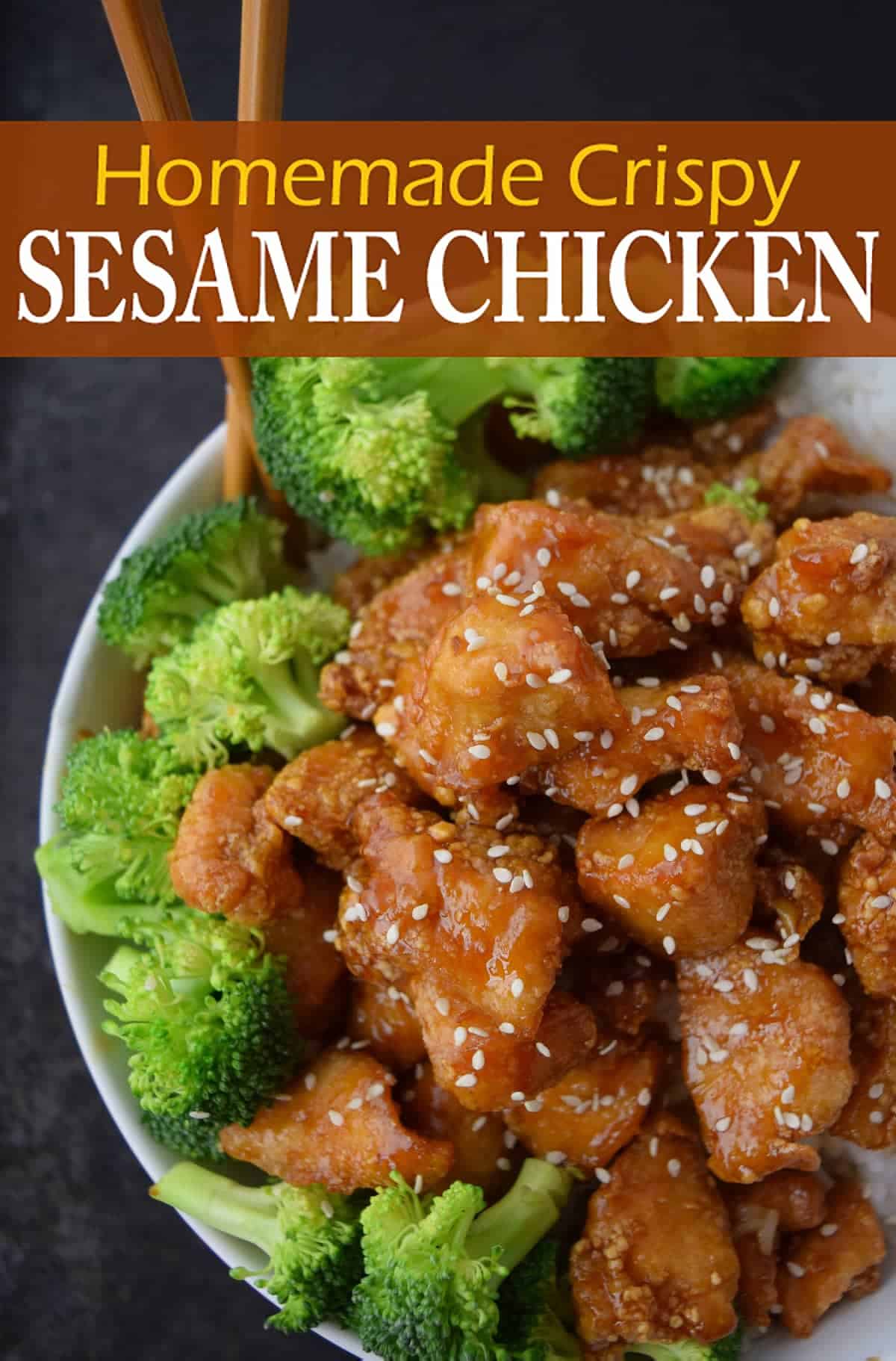 Glazed honey sesame chicken with sesame seeds in white bowl with broccoli with wooden chopsticks on black surface with recipe title.