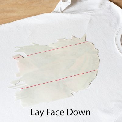 Cut out image laying face down on t-shirt.