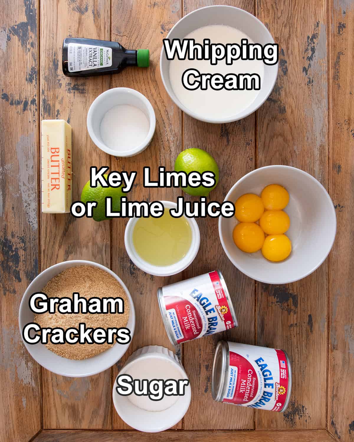 Ingredients for key lime pie bars laid out on a table with text labels.
