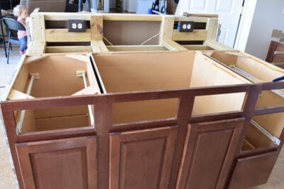 Kitchen base cabinets with countertops removed.