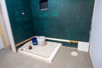 A bathroom remodel showing a ledger board in the correct location at the bottom of a wall.