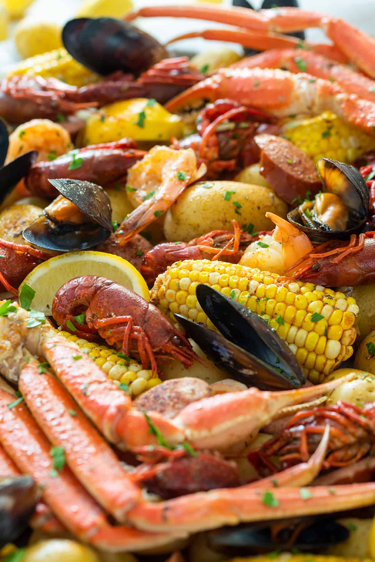 Closeup of a cajun crawfish and seafood boil with corn and potatoes.
