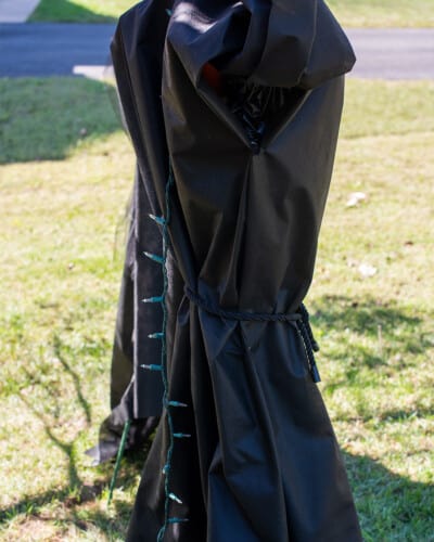 Side shot of making a life size witch halloween decoration.