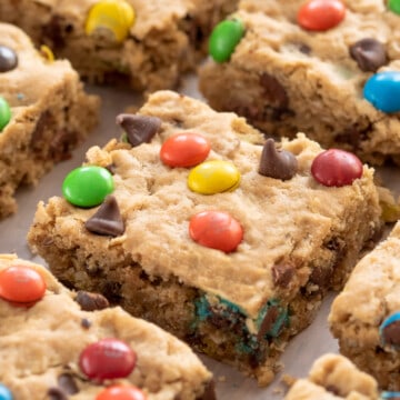 Closeup of monster cookie bars laid out on a tray.