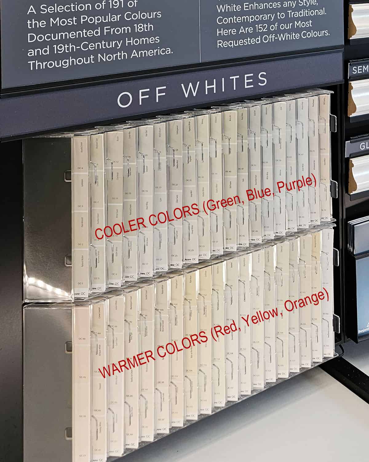 Color swatches in order of warm to cool colors including beiges, grays, and off-white paint colors at Benjamin Moore Store.