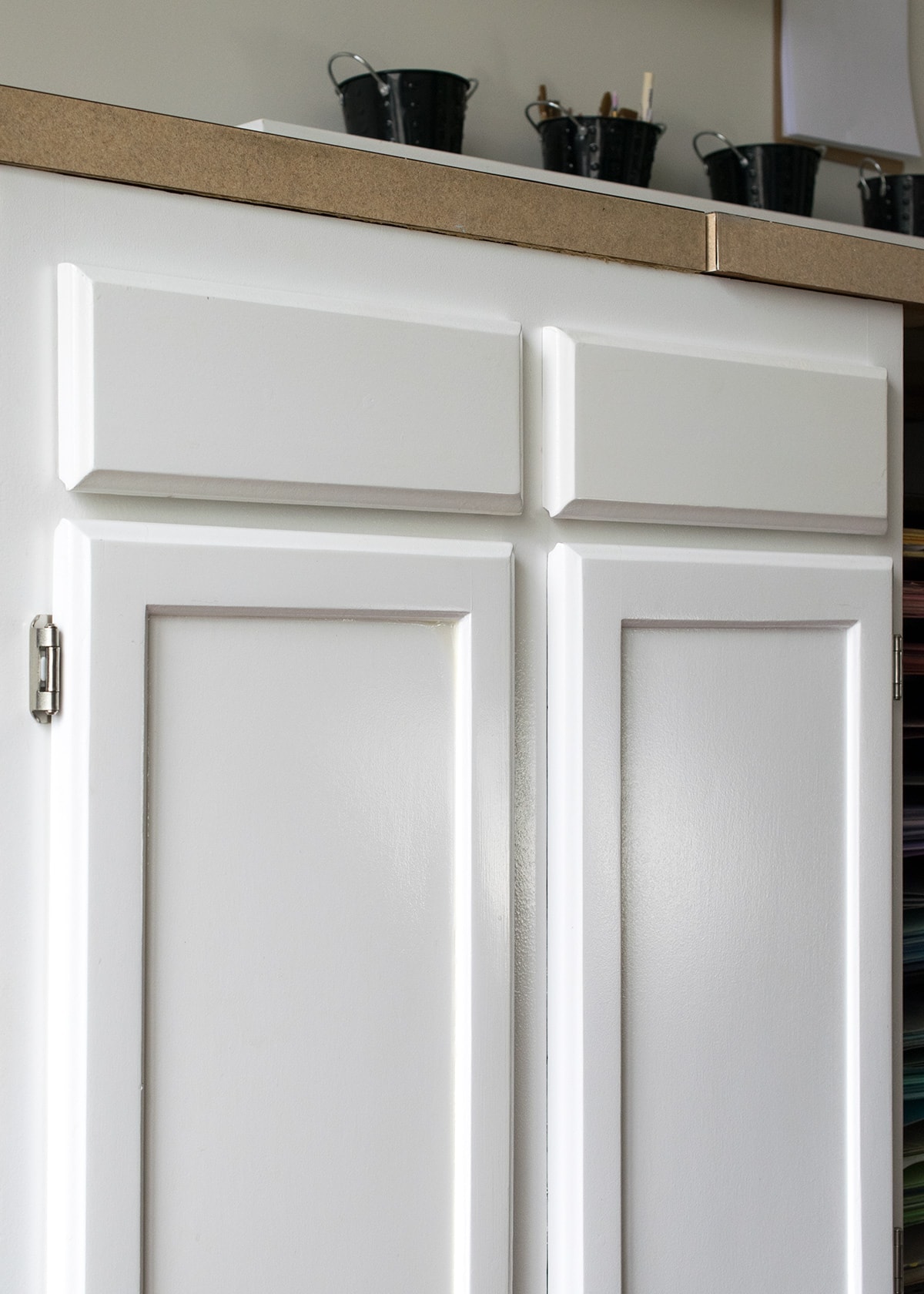 Closeup of smooth white cabinet doors.