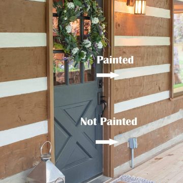 Progress of painted outdoor concrete cement masonry on a rustic log cabin house with a gray door.