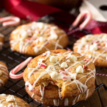 Peppermint white chocolate chip cookie with a bite taken out.