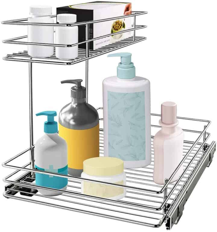 Tiered pull out tray with bottles standing in it. On white background.