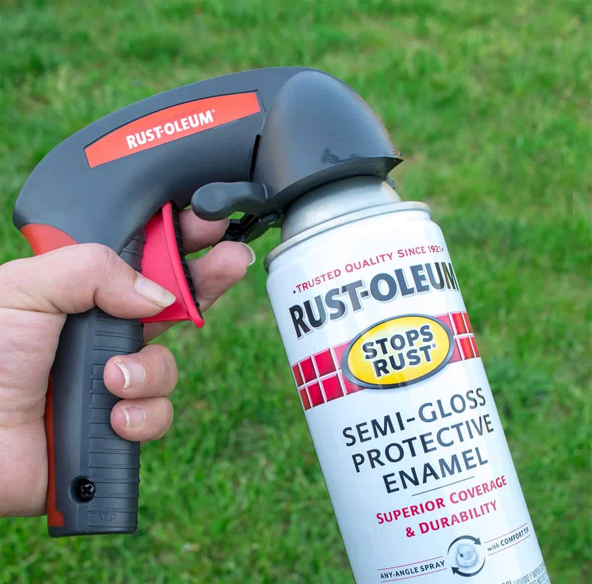 Can of rustoleum spray paint with comfort grip hand holder attached.