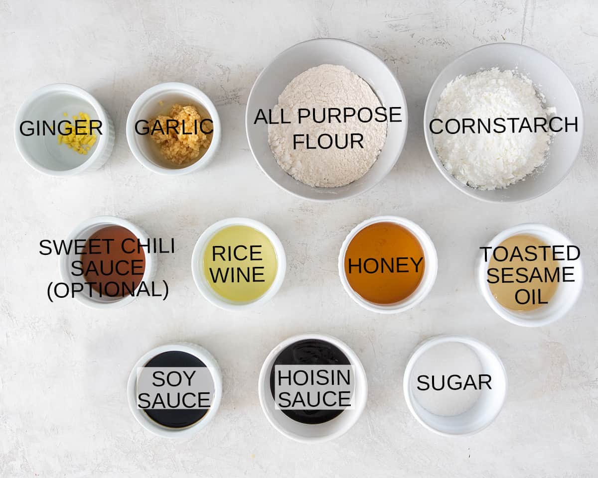 Ingredients to make honey sesame chicken recipe with text labels.