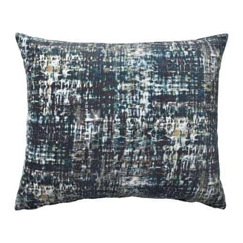 Ikea lumbar pillow with distressed teal print.