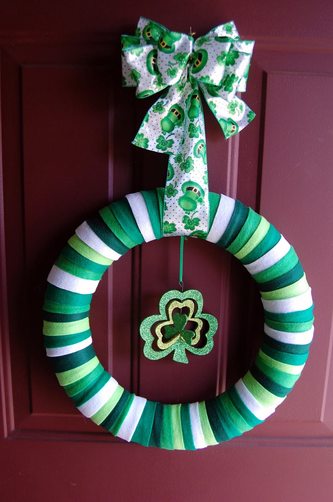Saint Patrick's Day green felt wreath on a door.