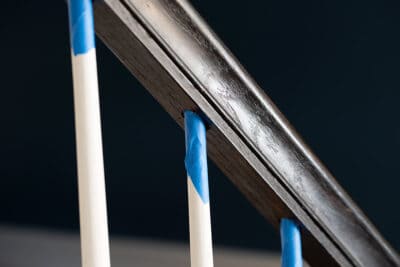 Tape on hand rails to paint with a clean edge.