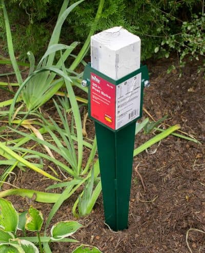 A temporary post being driven into the ground.