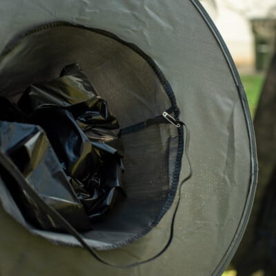 Safety pin in witch hat.