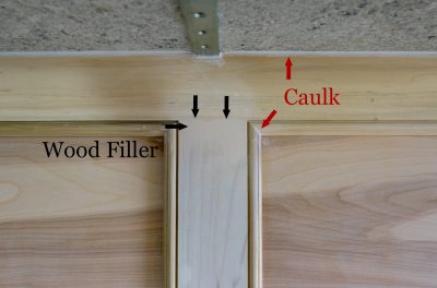 Closeup of kitchen bar showing where to caulk or wood fill.