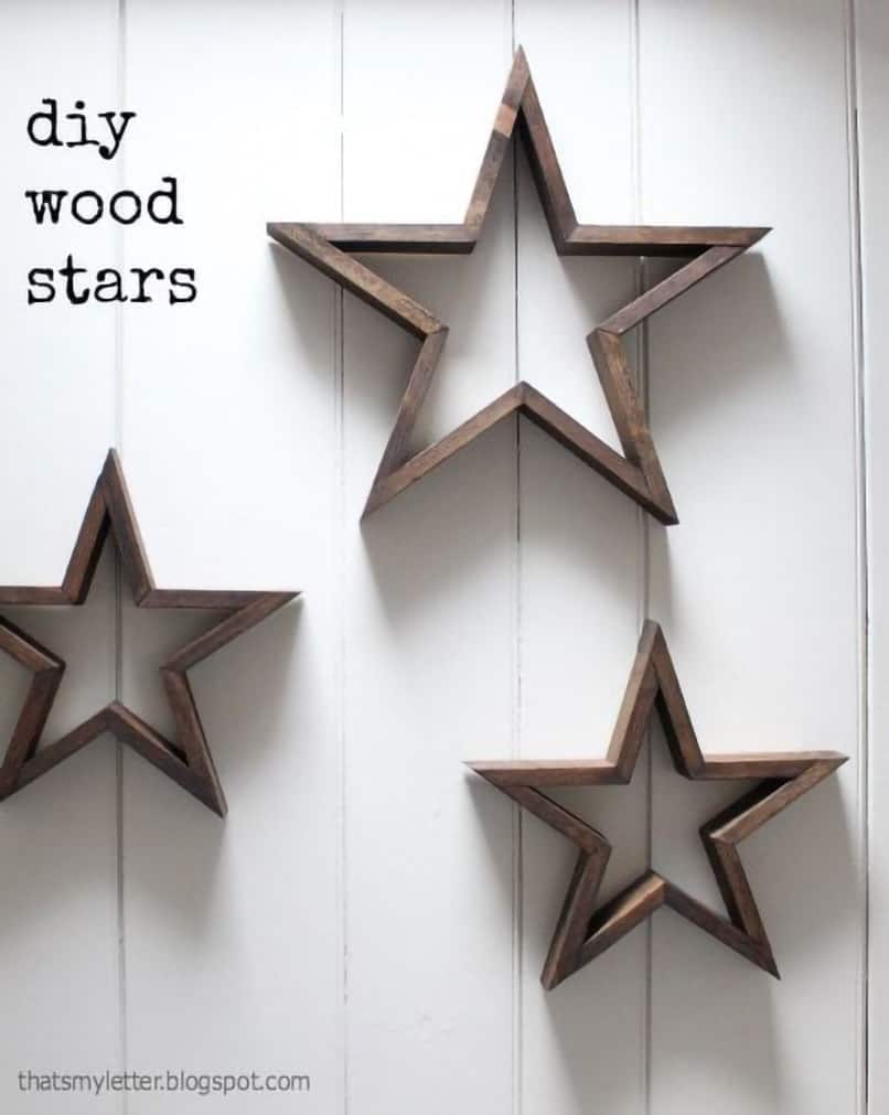 3-D star wall art on white paneled wall.